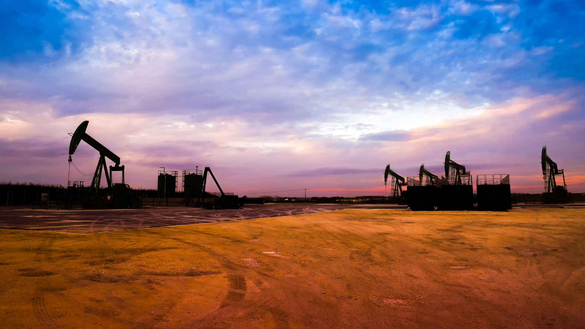 Photo of oil field against a saturated sunset