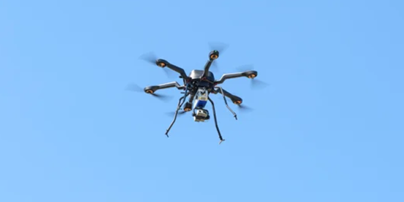 Drone with Bridger GML device flying across a blue sky