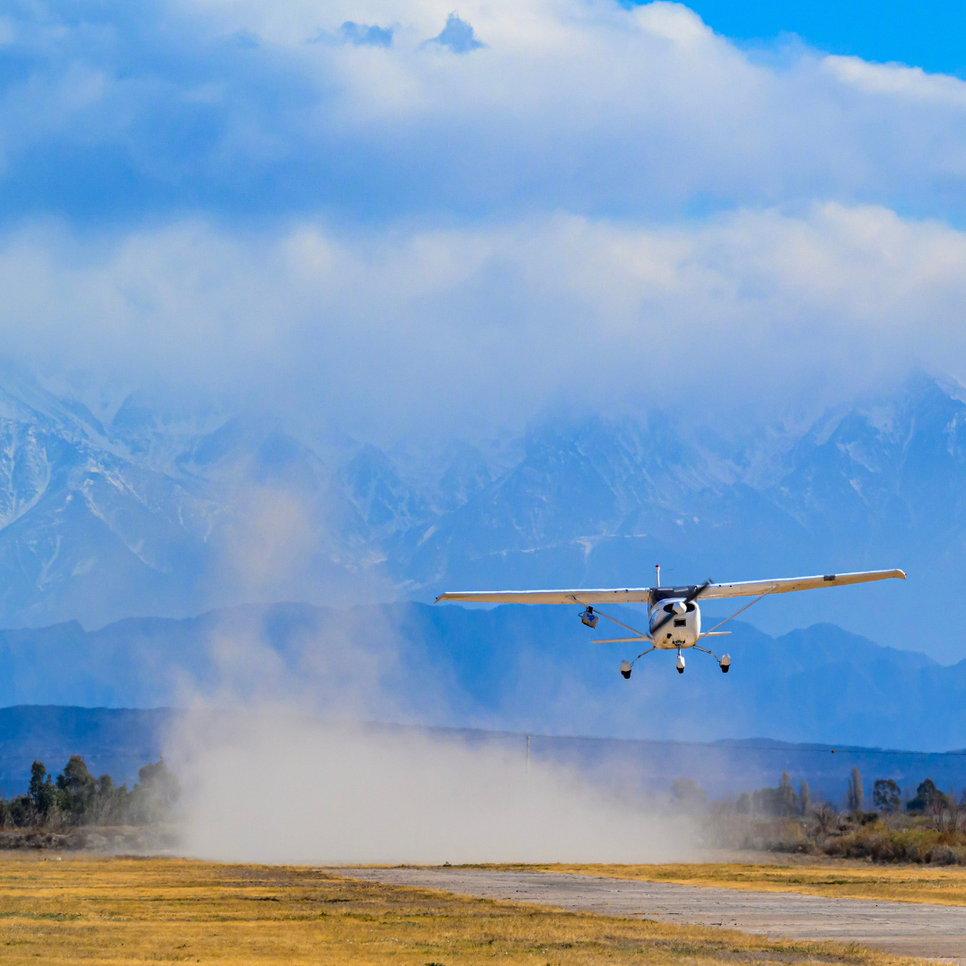 Plane with Bridger GML device landing in front of snowy Argentina mountains