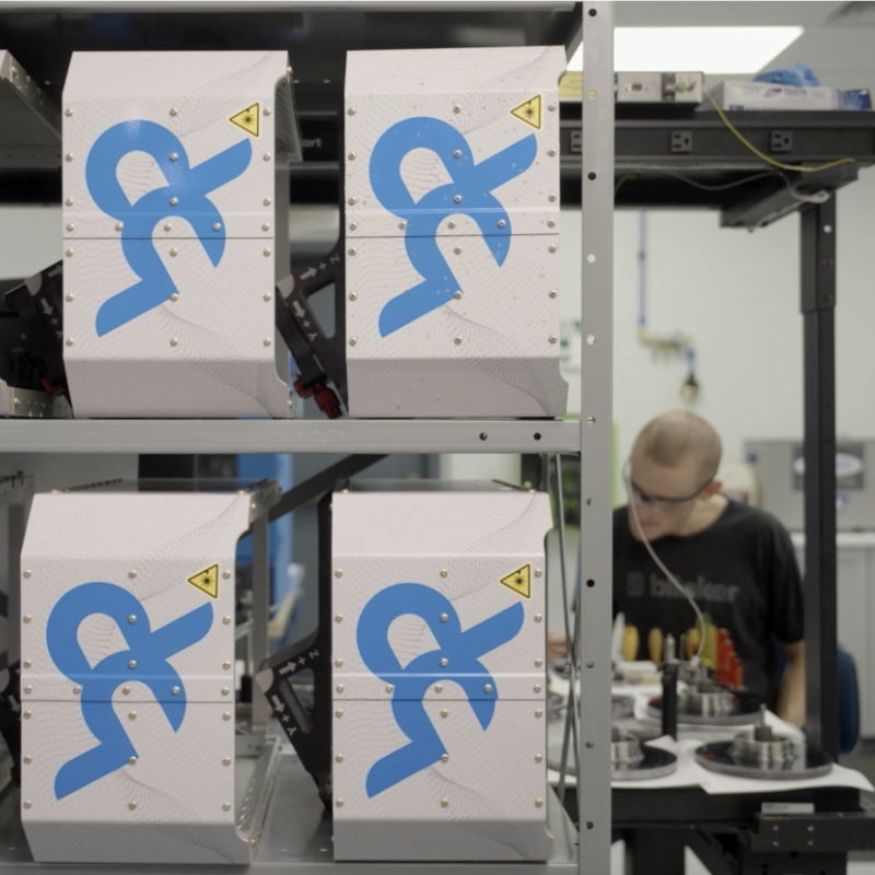 Shelves of Bridger GML devices with Man Working in Background