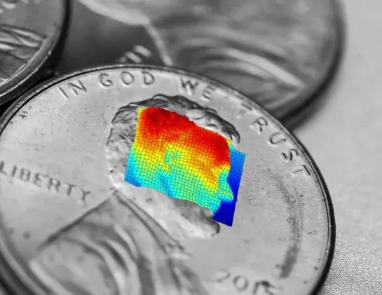 LiDAR graphic over the face of Abraham Lincoln on a black and white US penny